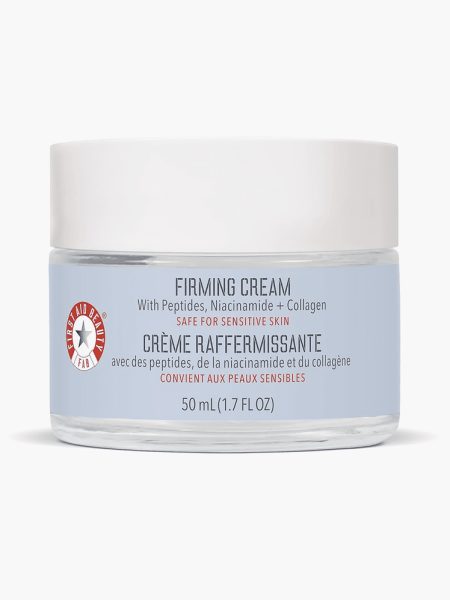 Firming Cream in branded clear jar with white lid on light gray background